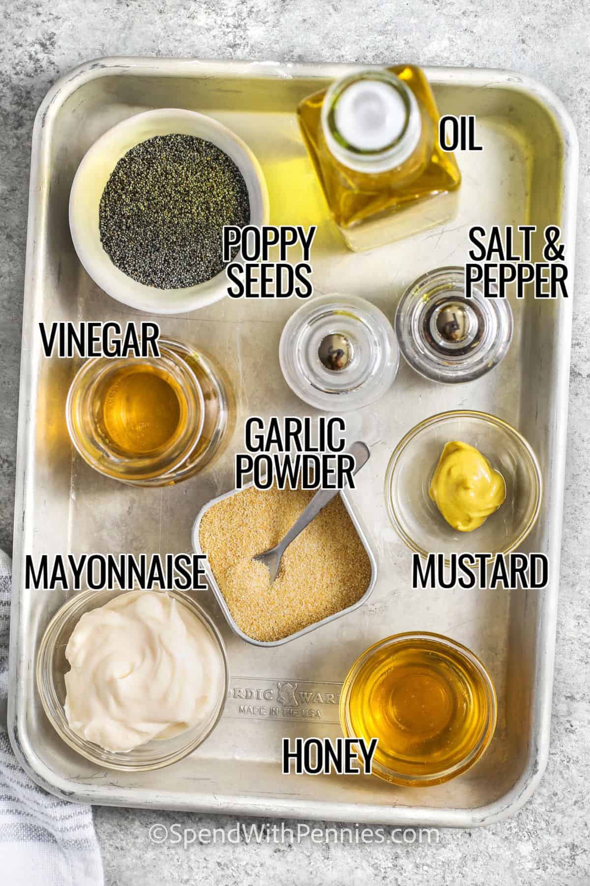 oil , poppy seeds ,vinegar , garlic powder , mayonnaise , honey , mustard , salt and pepper with labels to make Poppy Seed Dressing