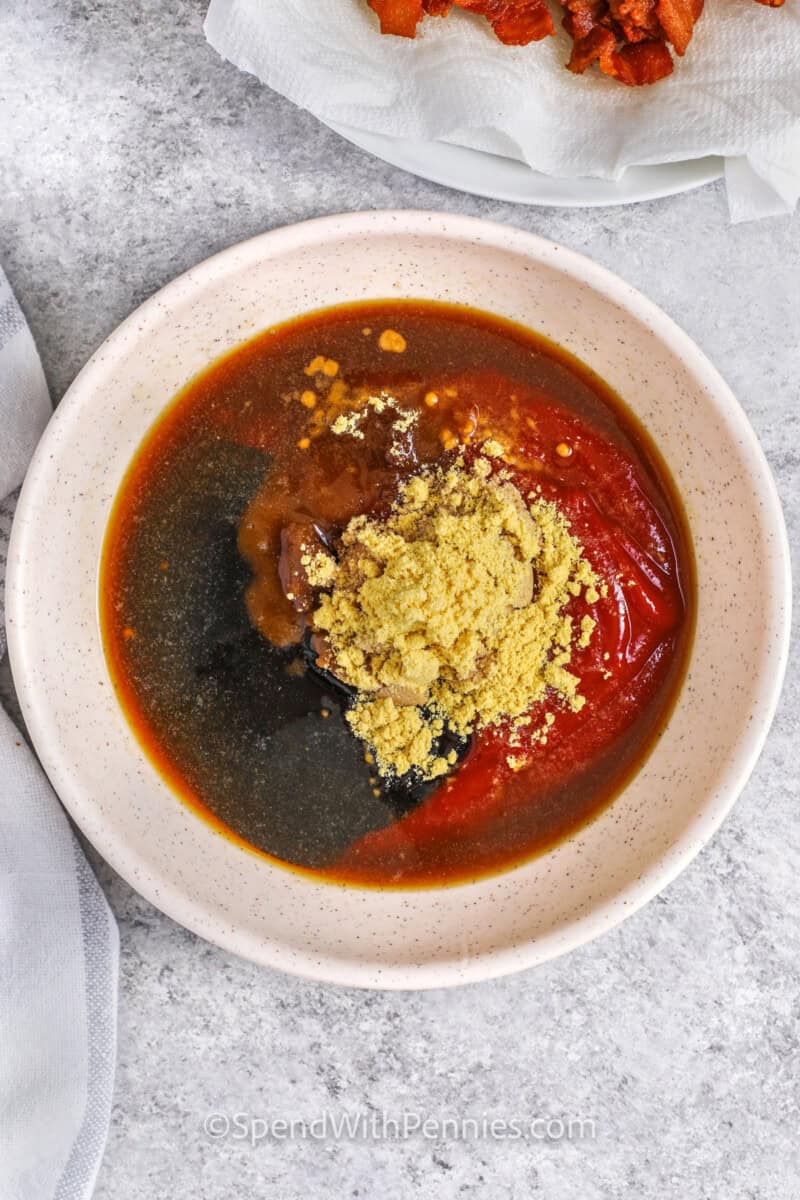 adding ingredients together to make sauce for The Best Baked Beans