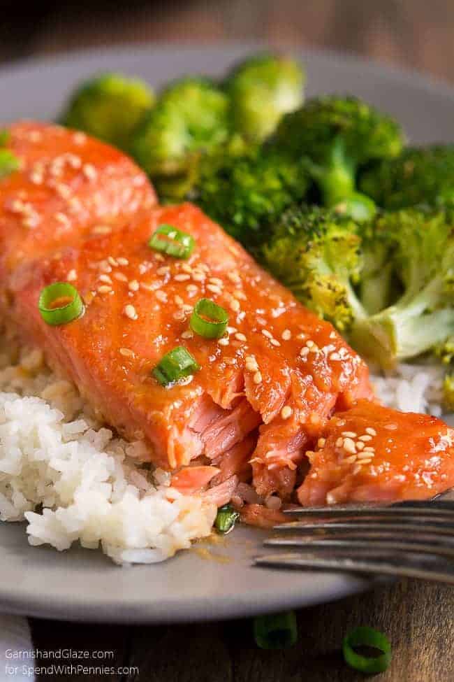 One Pan Sesame Ginger Salmon on a grey plate, served over rice and a side of broccoli