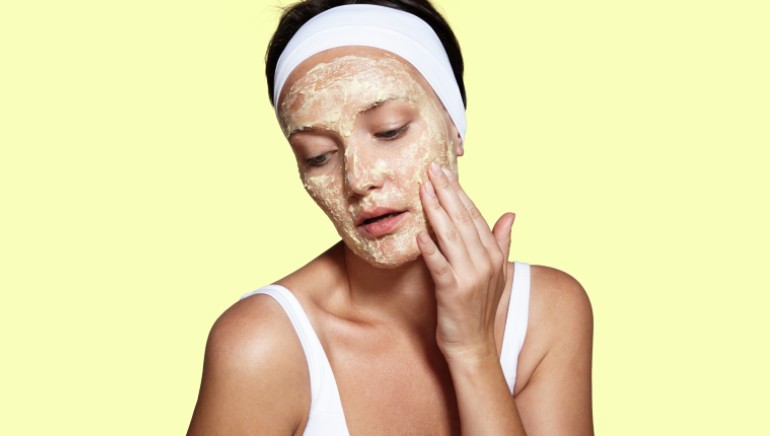 A woman using clay mask 