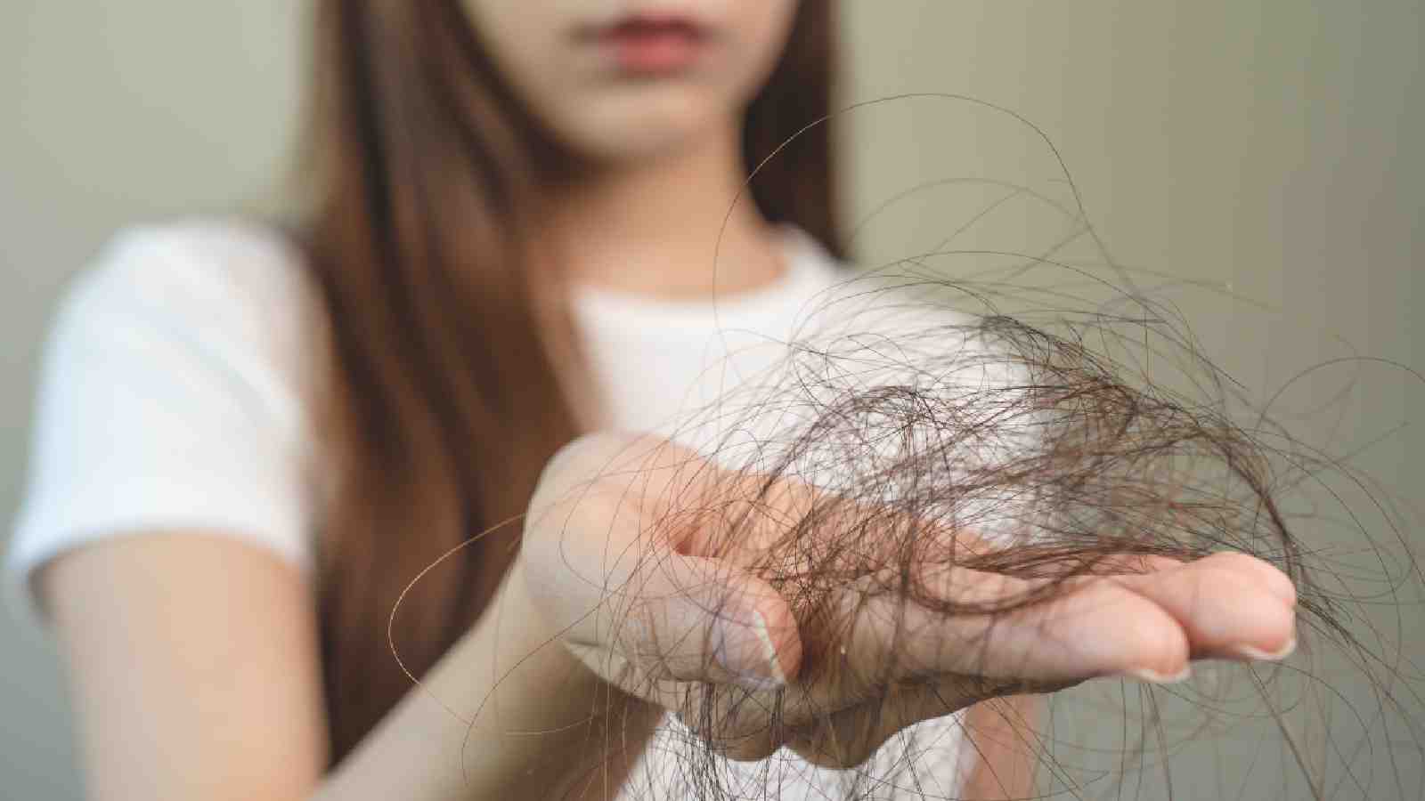 A woman experiencing hair loss