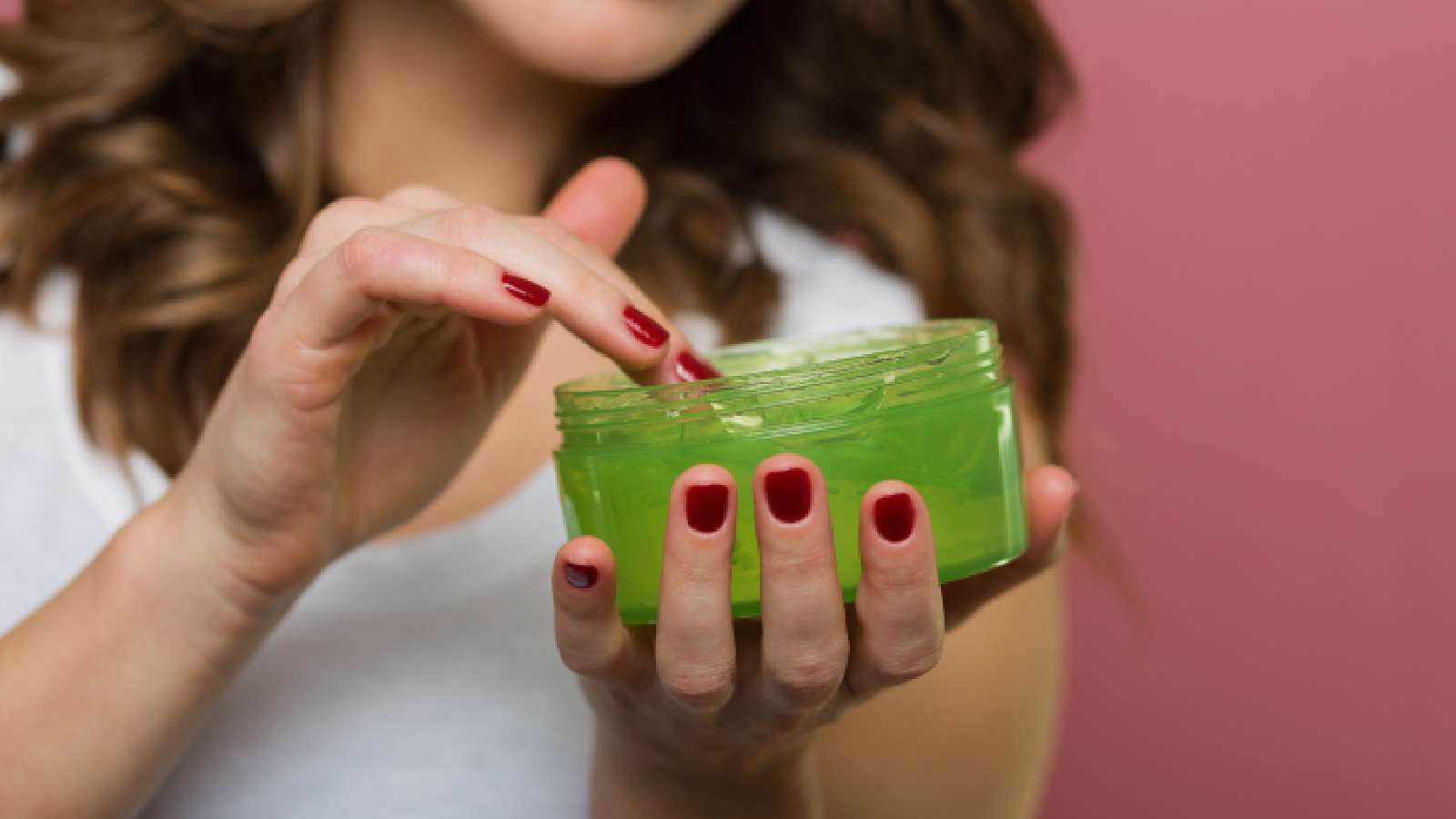 woman using aloe vera gel