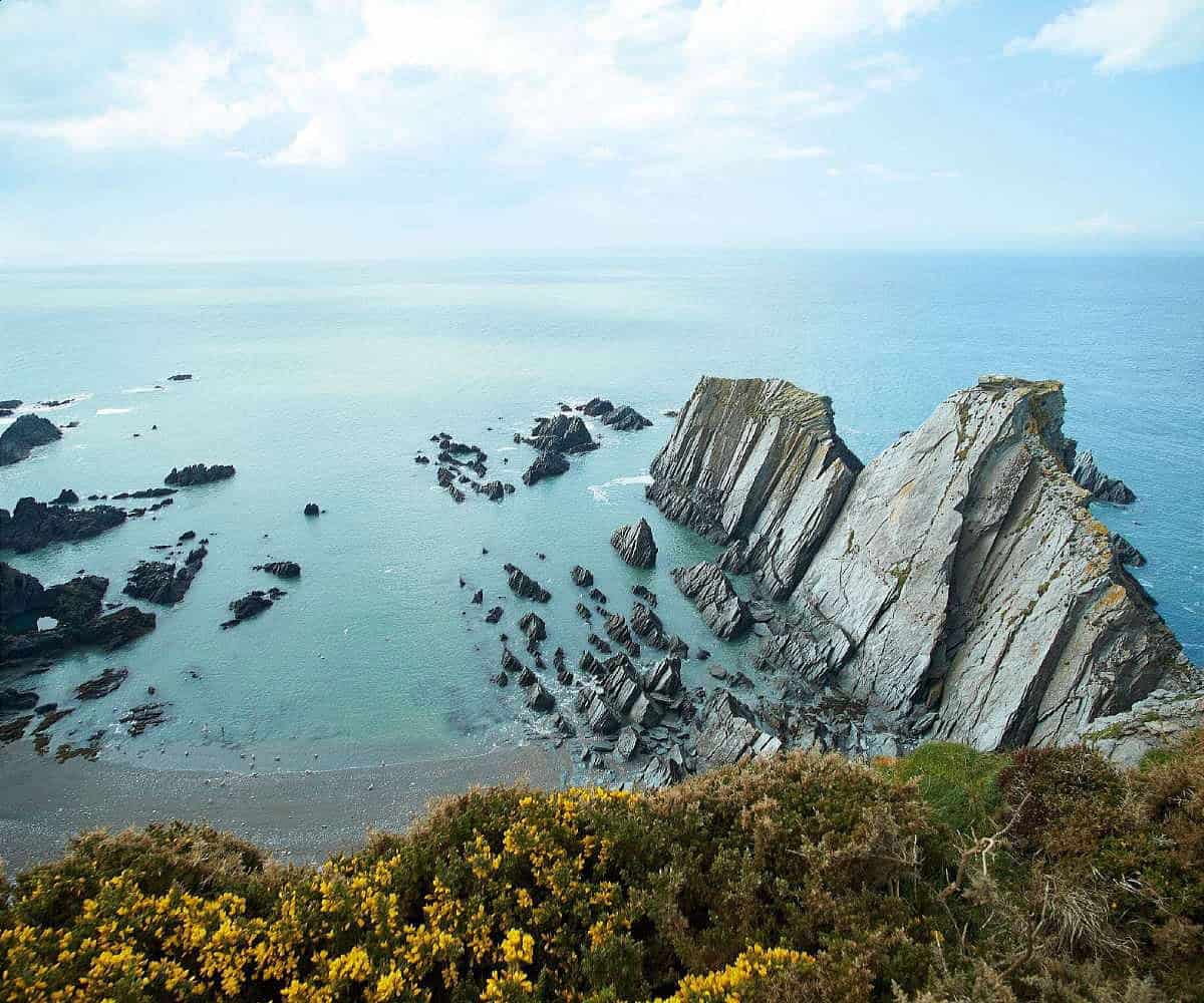 Bull Point Lighthouse view across Bristol Channel from the headland Devon Hideaways modified