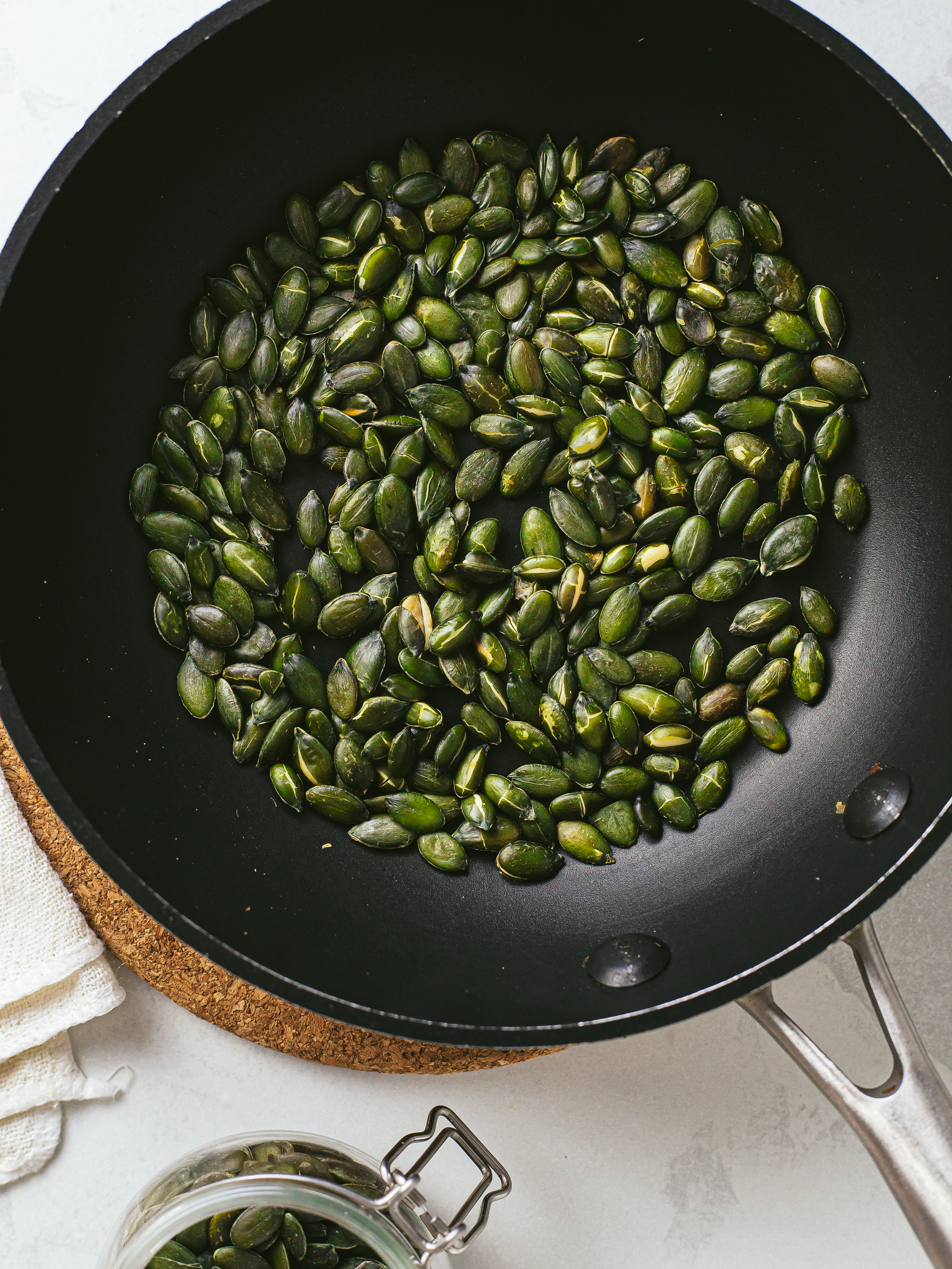 pumpkin seeds toasted in a skillet