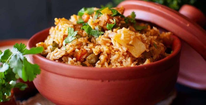 Top view of terracotta bowl with chettinad veg biryani.
