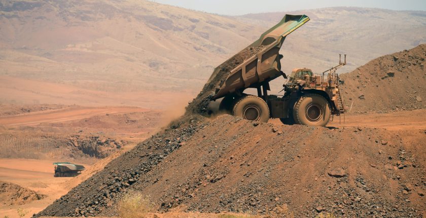 autonomous truck at rio tinto iron ore mine in australia bloomberg scaled