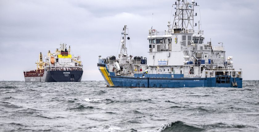 swedish coast guard vessel next to cargo ship vezhen in baltic sea AP scaled